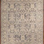 Rug features a pale grey background with elegant highly stylized floral patterns throughout
