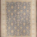 Mahal design on soft blue background surrounded by an ivory main border and soft gold guard stripes